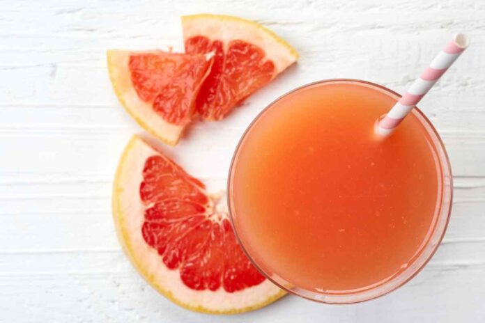 Glass of fresh grapefruit juice from top view